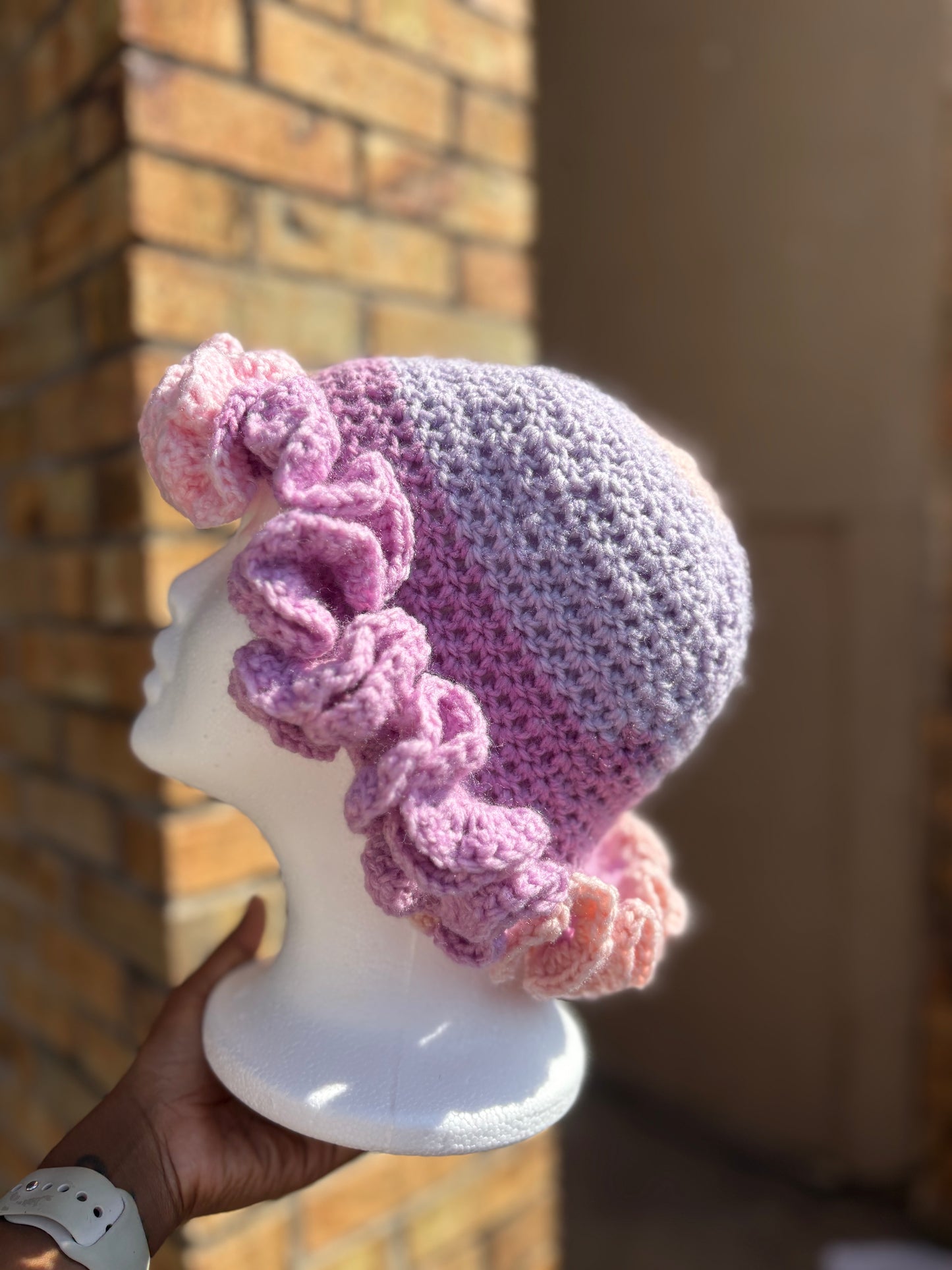 Handmade pink and lavender crochet ruffle brim hat on mannequin – Hartfelt Crochet